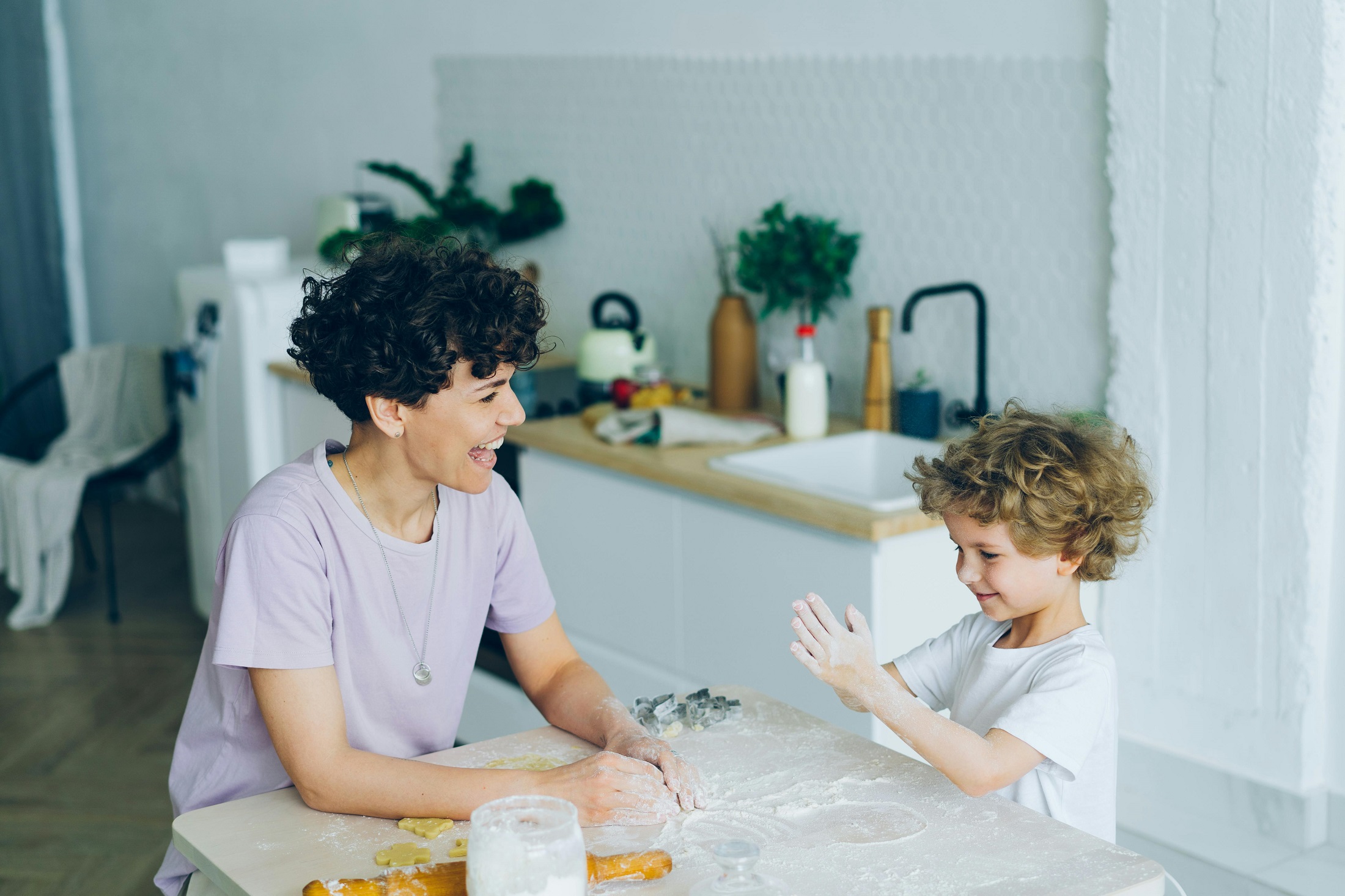 mother and child playing in the kitchen